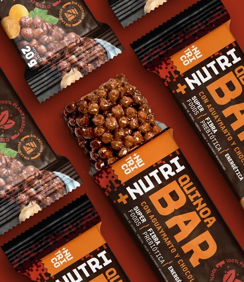 NUTRI Co quinoa bars arranged in a pattern on a red backdrop